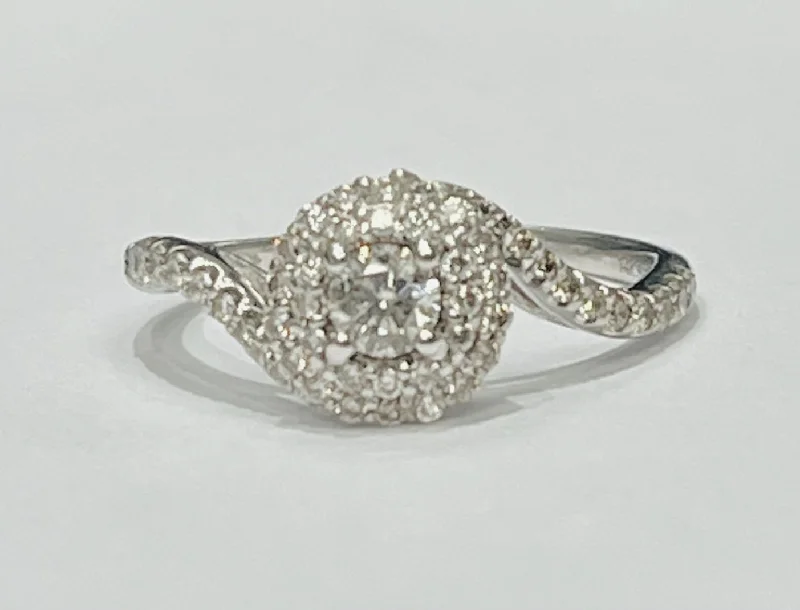 ladies engagement rings radiant-This gorgeous engagement ring features a 1/2ctw in natural d...